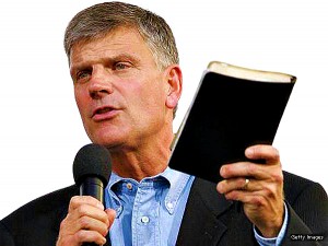 NEW  YORK - JUNE 25:  Franklin Graham, with Bible in hand, addresses the crowd before his father Billy Graham speaks  June 25, 2005 in the Queens borough of New York. (Photo by Stephen Chernin/Getty Images)